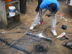 Ghana: Welder operating in a GIZ-supported industrial zone in Ghana. GIZ is supporting the development of these zones both in terms of infrastructural improvements such as electricity connection as well as business trainings of the entrepreneurs. <br />
© GIZ / Samuel Adoboe